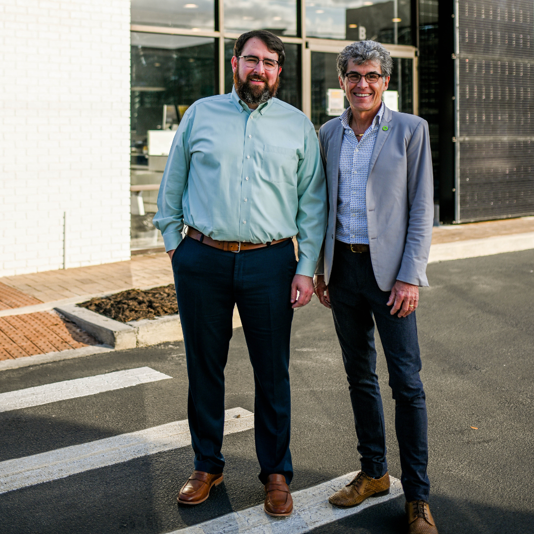 Ken LaRoe, CEO of Climate First Bancorp, standing with Lex Ford, President of Climate First Bank.