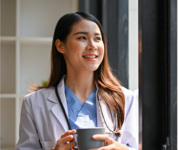 Physician holding a coffee mug